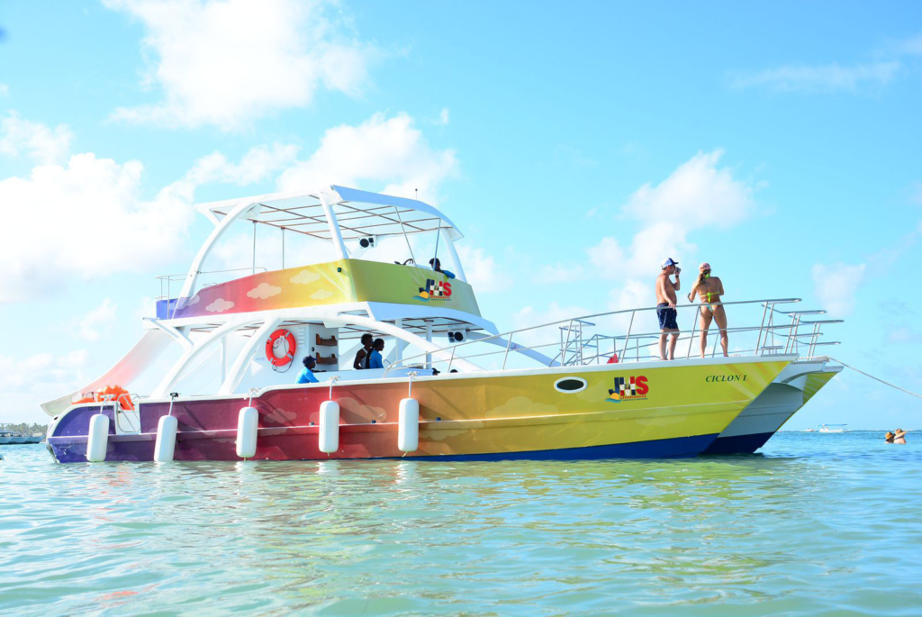 Catamaran cruise in Punta Cana with guests sailing on turquoise Caribbean waters during a tropical boat excursion.